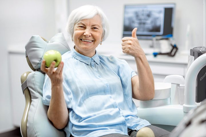 Senior with dental implants