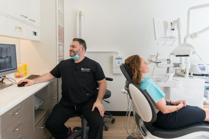 Dr Dean examines a patients scans